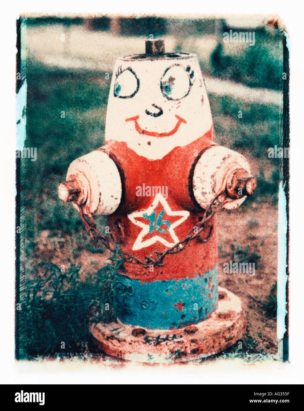 Polaroid transfer image of fire hydrant painted as a human character Stock Photo