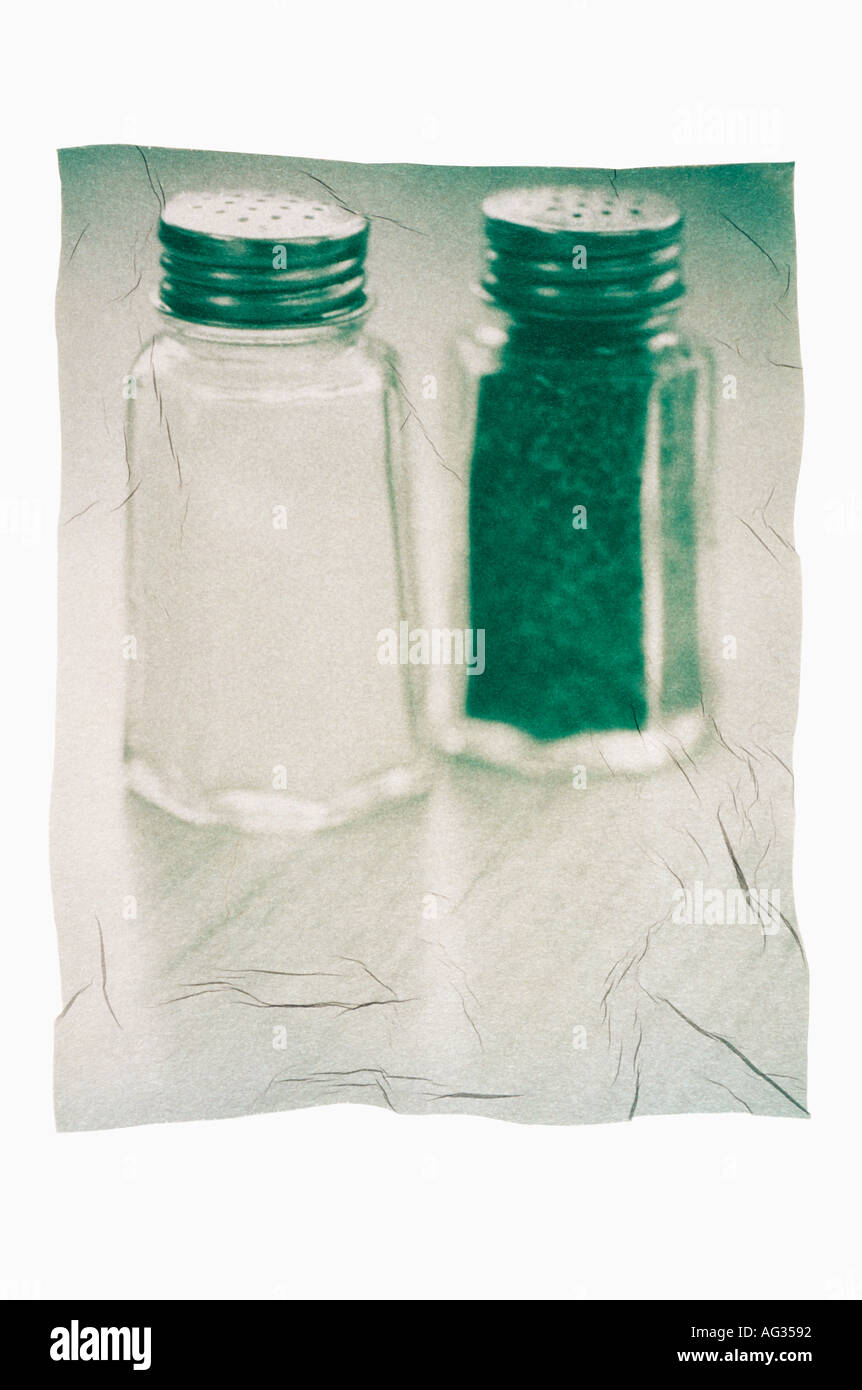 Emulsion transfer image of  green misshapen salt and pepper shakers Stock Photo