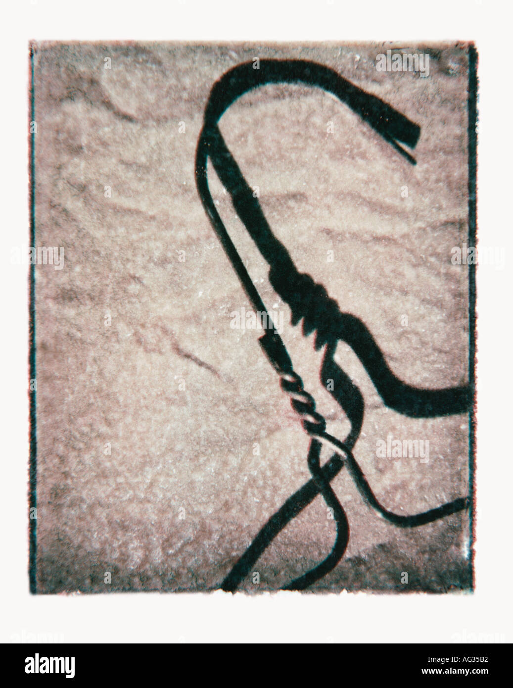 Polaroid transfer image of wire clothes hanger Stock Photo