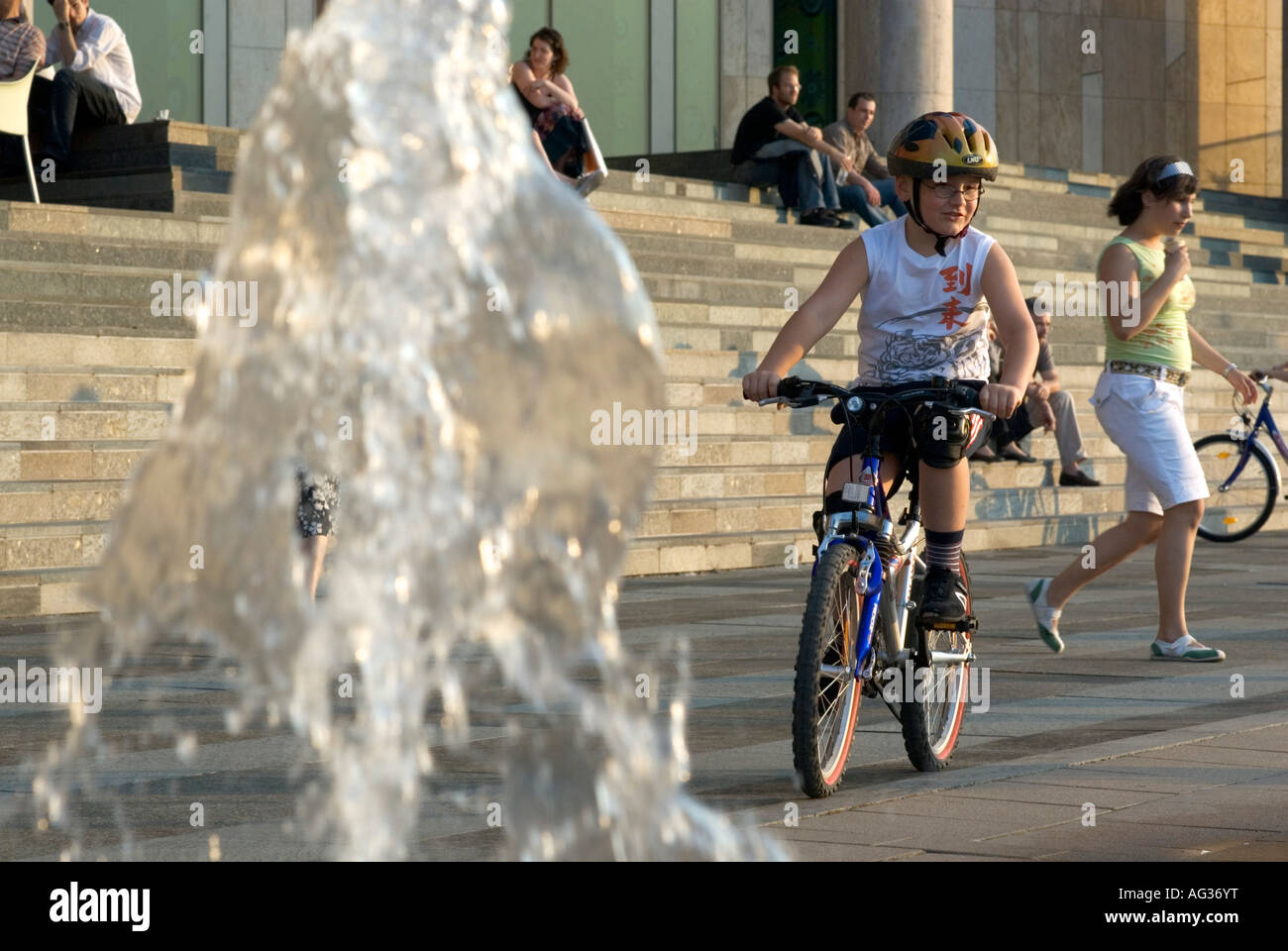 Kid on Bike at the Palace of Arts Muveszetek Palotaja Budapest Hungary Europe Stock Photo