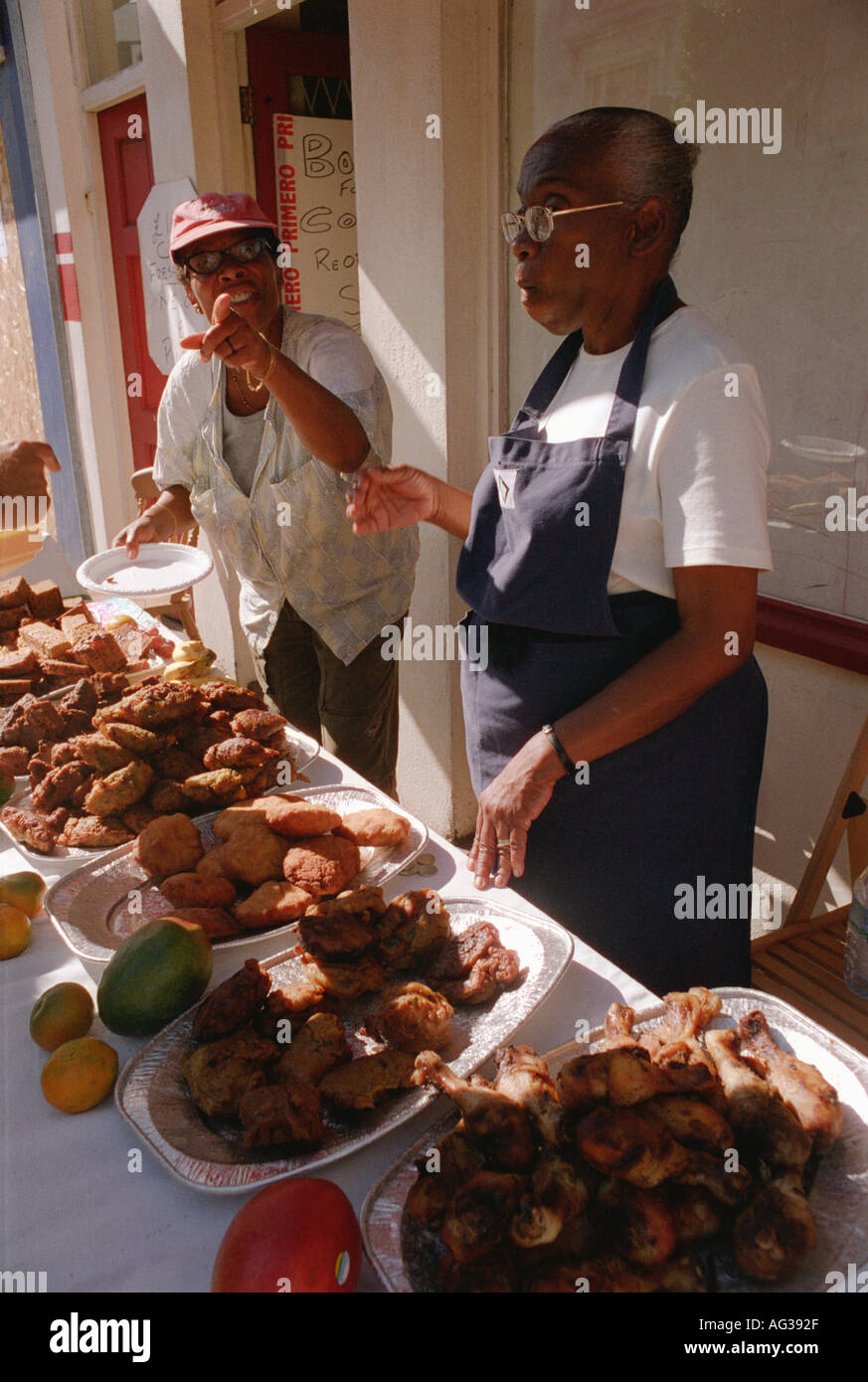 Selling ethnic West Indian food in the streets at Notting Hill carnival