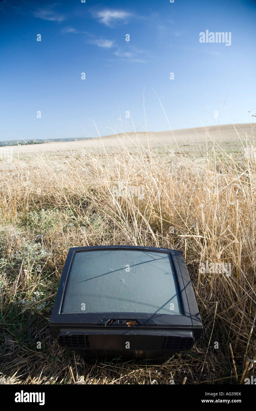 TV receiver thrown on a wheat field on countryside Spain Stock Photo
