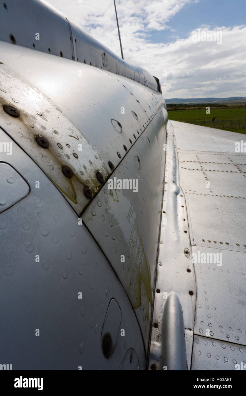 Retired MiG-21 fighter aircraft, close up on rusty panels and rivets on fuselage Stock Photo