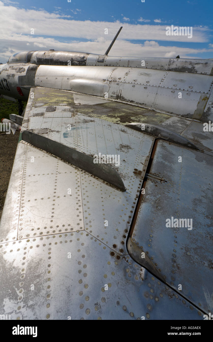 Aluminium MiG-21 retired aircraft, wing as shown is extremely weathered and in patchy condition Stock Photo