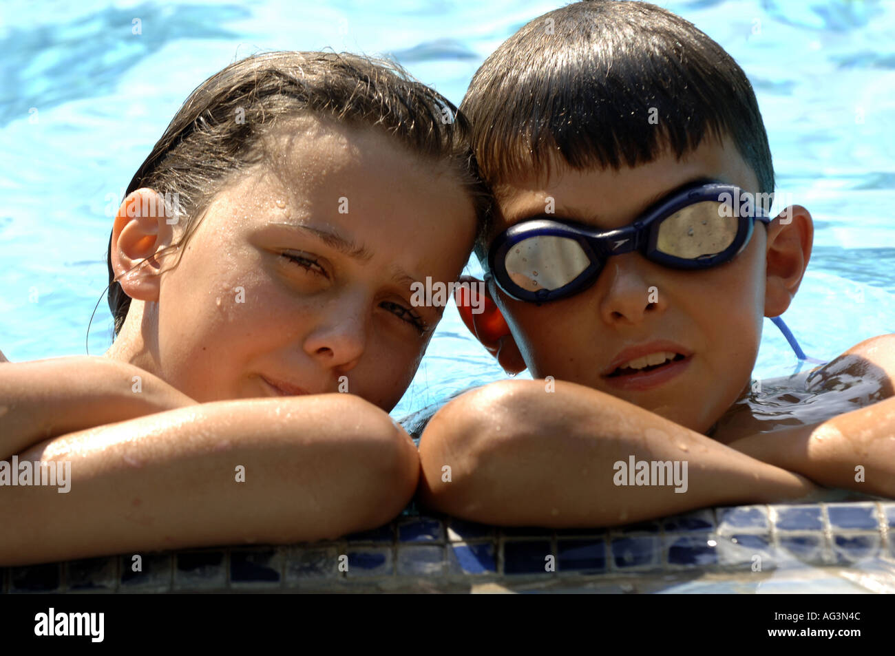 brother and sister together siblings pool swimming Stock Photo - Alamy