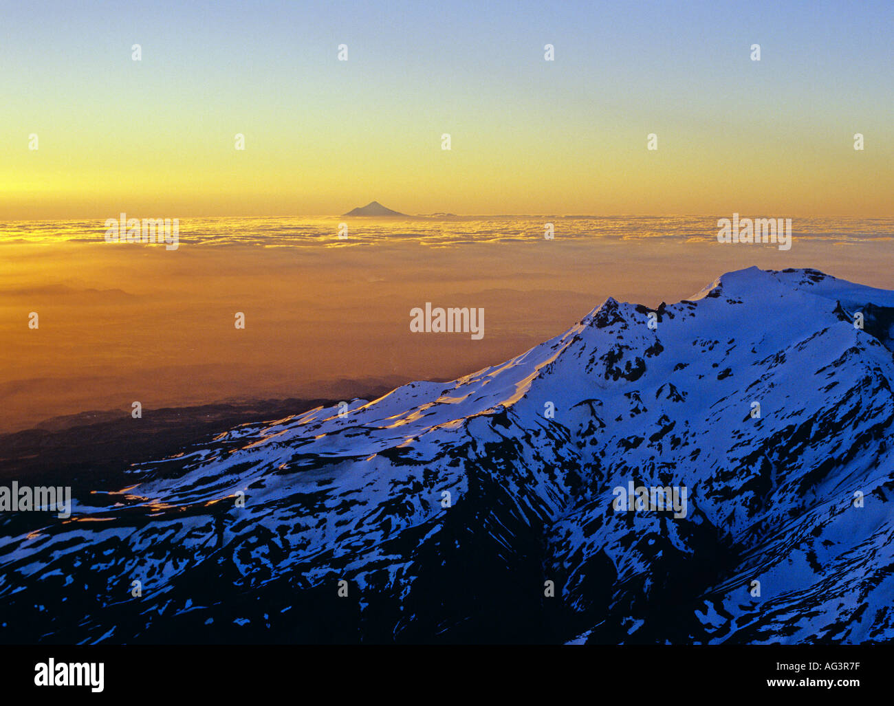 Aerial view of Mount Ruapehu and Mt Egmont in distance the Sunset Stock