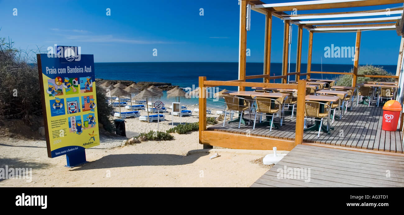 Blue flag beach sign next to a beach cafe at Gale near Albufeira Algarve  Portugal Stock Photo - Alamy