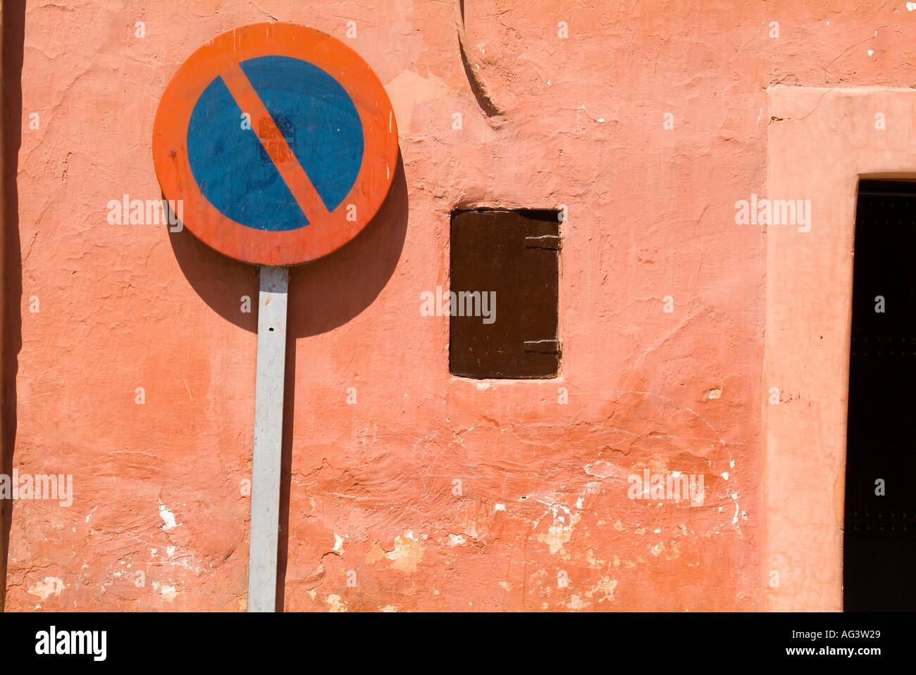 No entry sign in front of traditional pink coloured, colored, wall in narrow street Mella district of Marrakech,Morocco Stock Photo