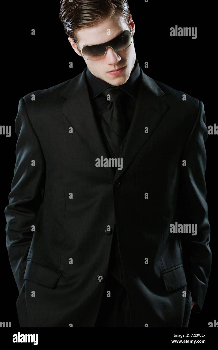 Man wearing a suit and sunglasses Stock Photo - Alamy