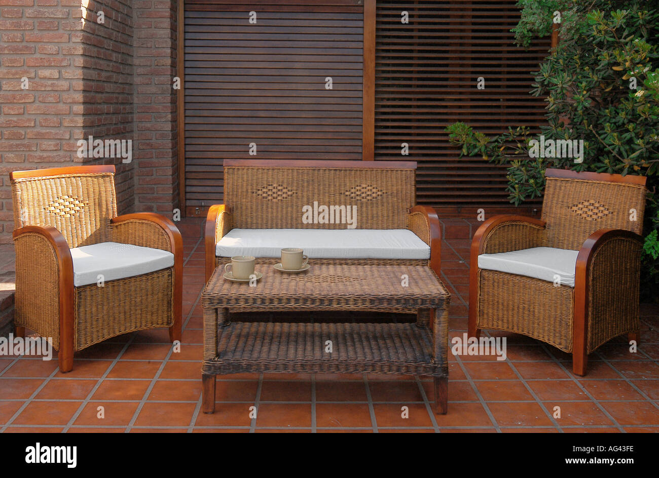 Rattan garden chairs and table set Stock Photo Alamy