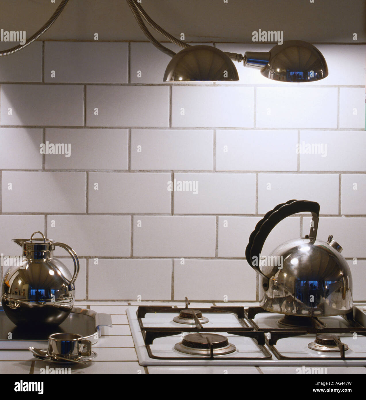 Chrome "Alessi" kettle on gas hob in modern kitchen Stock Photo Alamy