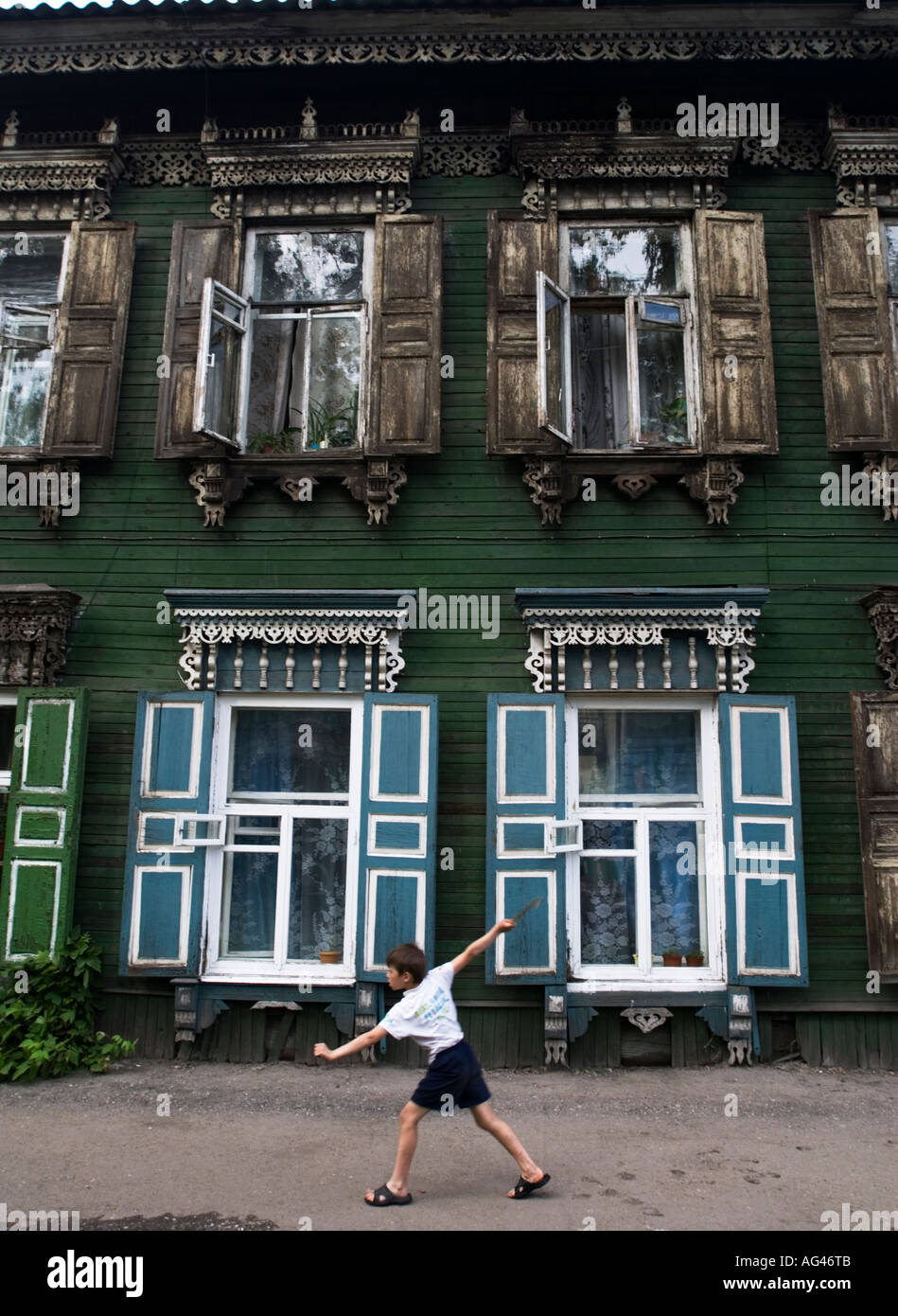 Old ornate wooden windows in house in Irkutsk Siberia Russia 2006 Stock Photo