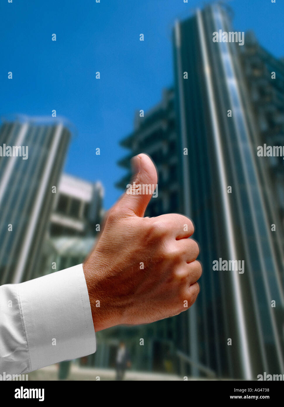 Thumbs up and high finance building for success and progress Stock Photo