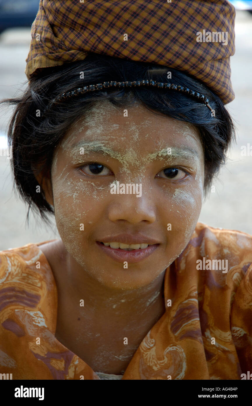 Girl in a headdress wearing thanakha Yangon Myanmar Stock Photo