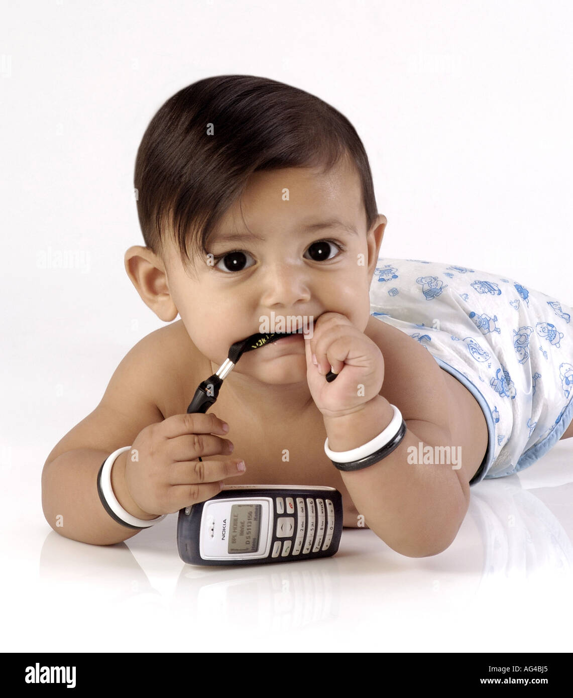 HMA79252 South Asian Indian small baby boy child in mood with mobile Model released Stock Photo