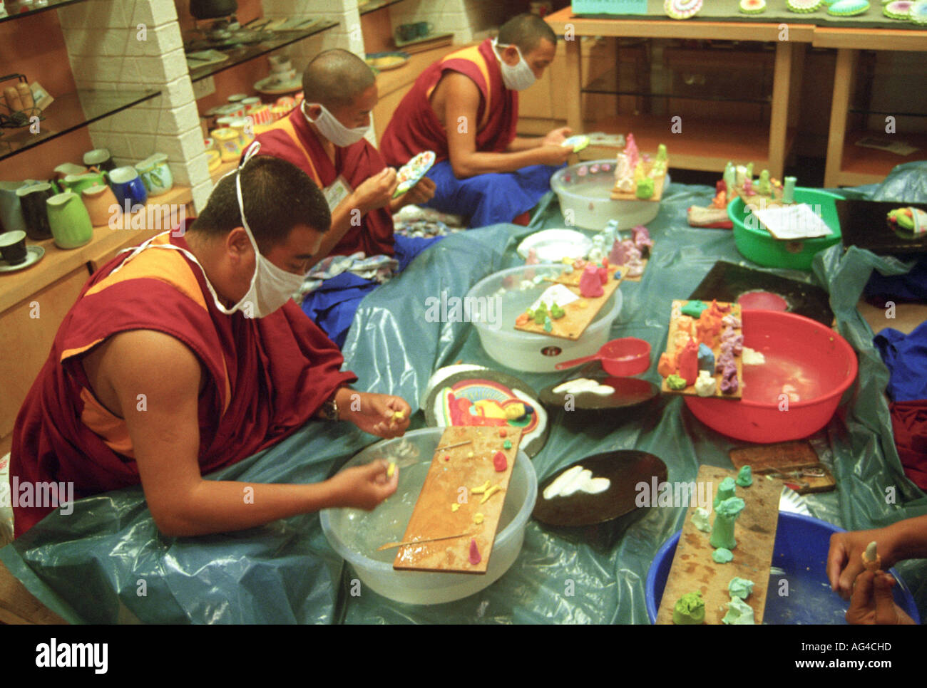 ASB79428 Tibetan monks making butter sculptures of Lord Gautam Buddha Stock Photo