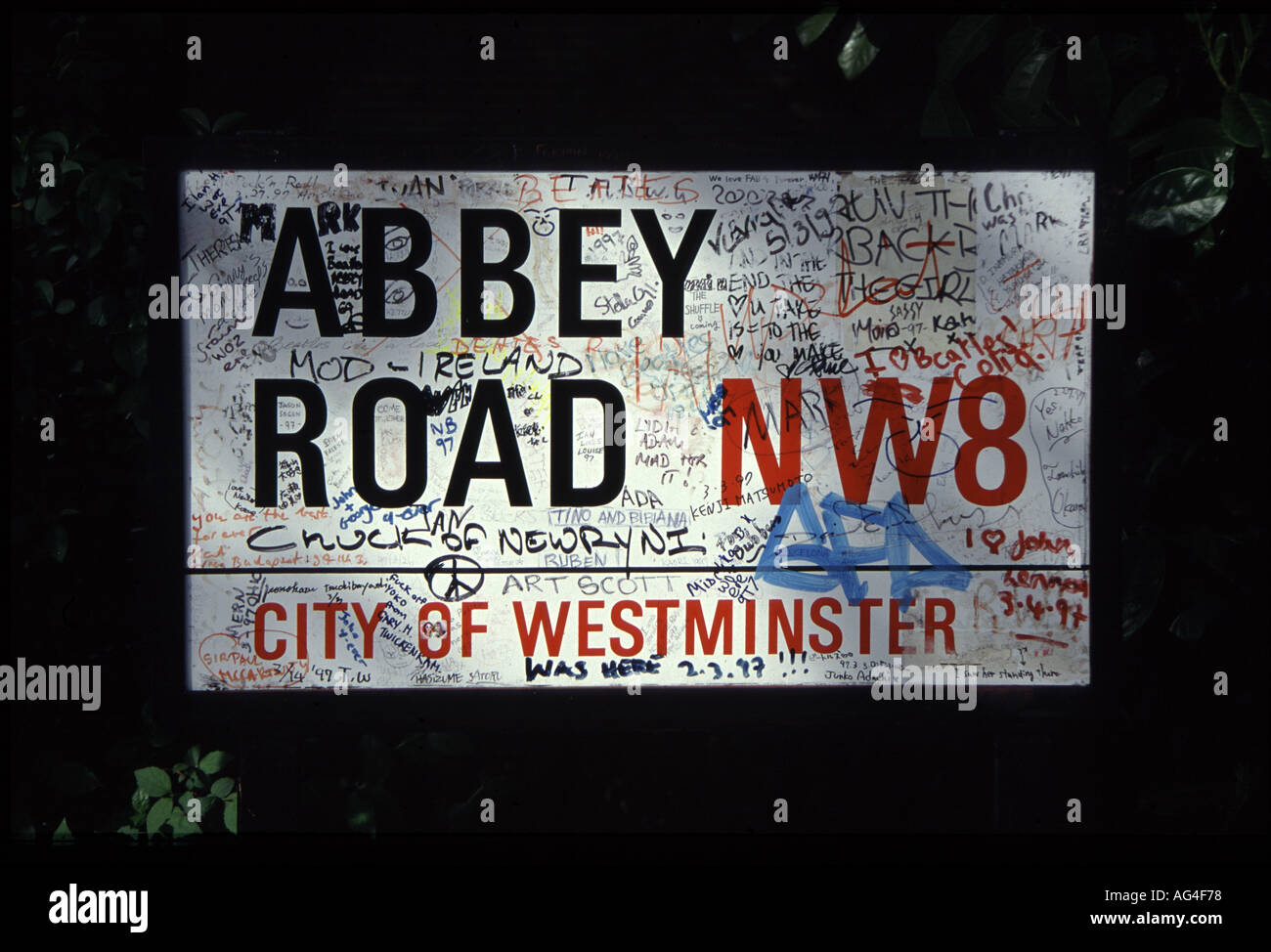Road sign outside the Abbey Road recording studio with messages from Beatles fans written on it Stock Photo
