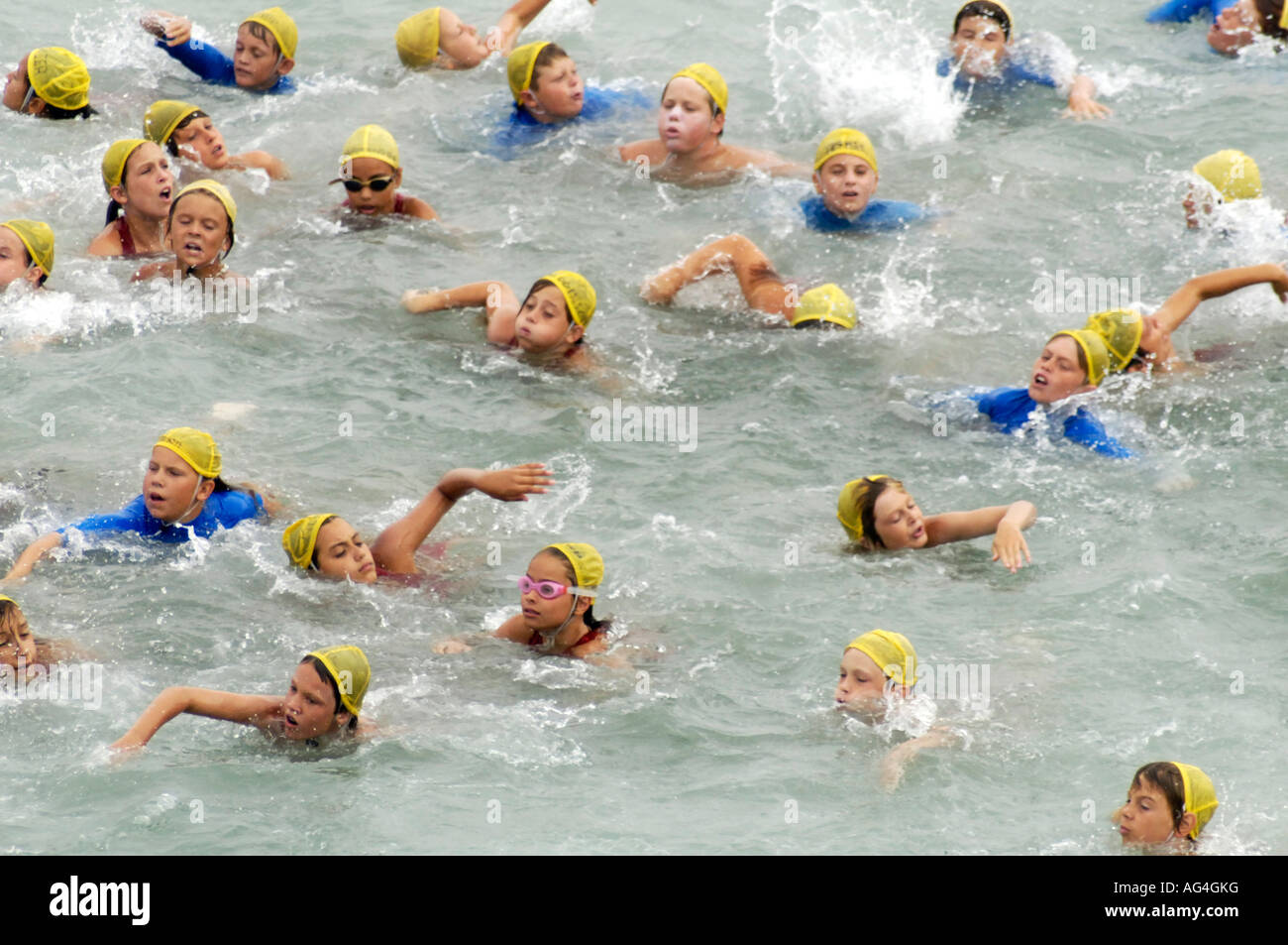 Junior lifeguards on a training swim around the Huntington Pier in
