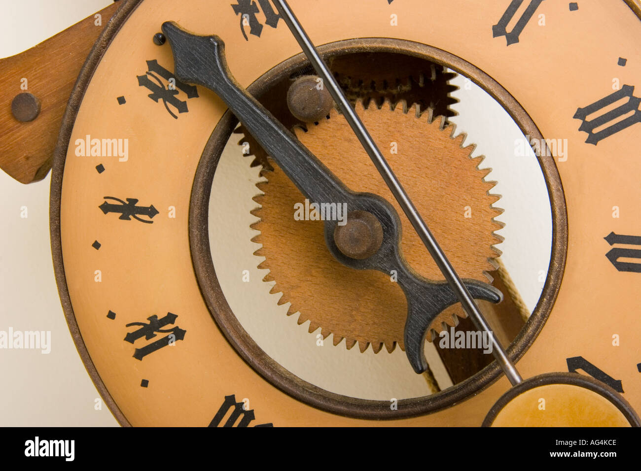 Close up of an antique wooden clock with only an hour hand Replica of a
