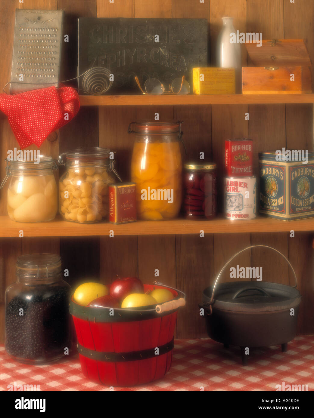 Vintage pantry with fruit preserves antique utensils cookware and food