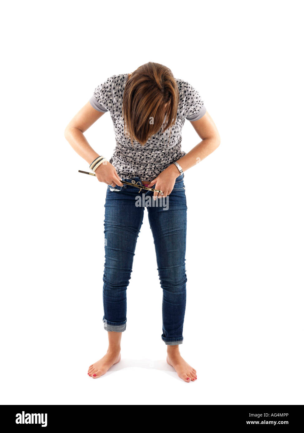 Woman putting on tight jeans hi-res stock photography and images - Alamy