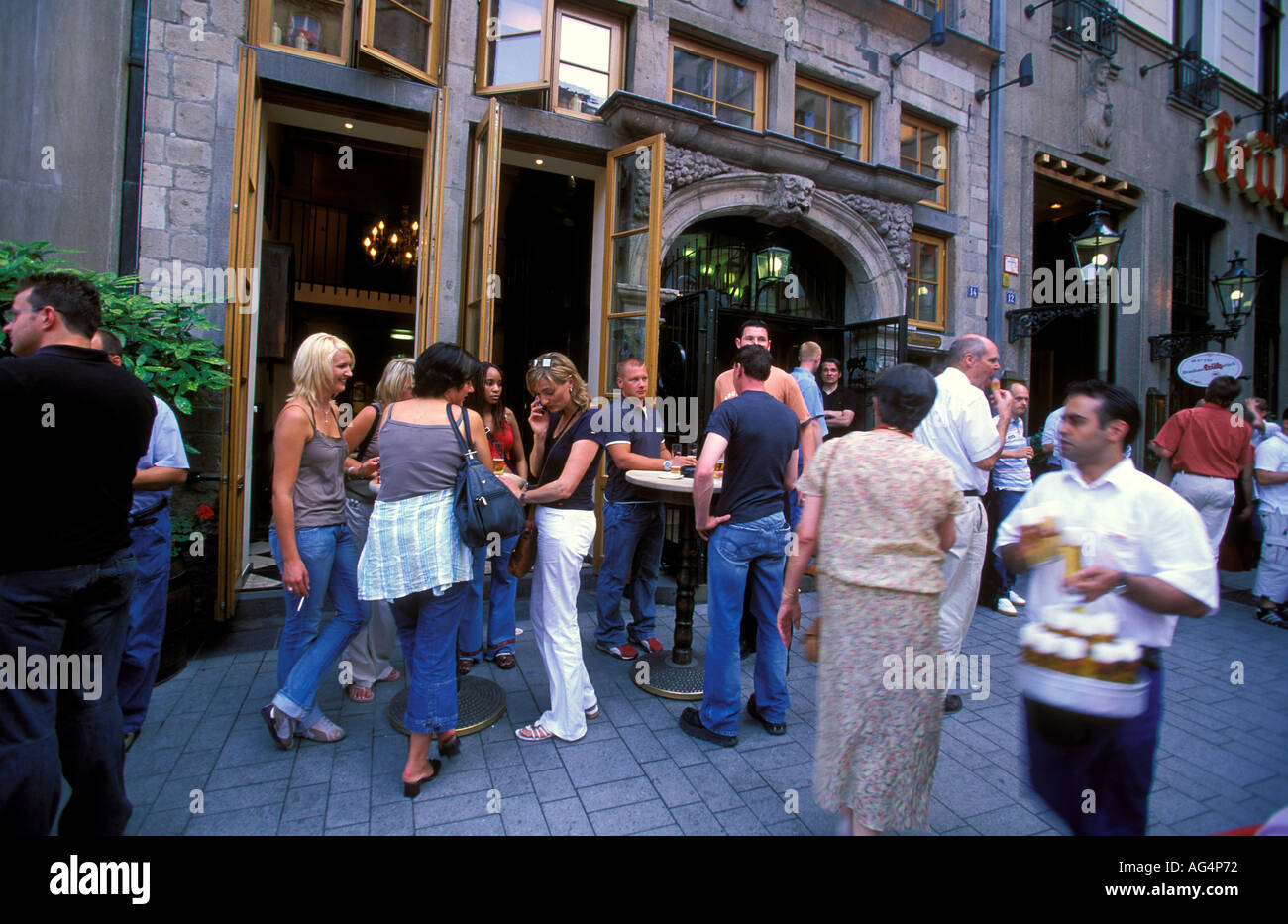 Germany North Rhine Westphalia Cologne People drinking beer outside the Fruh am Dom Beer Hall in