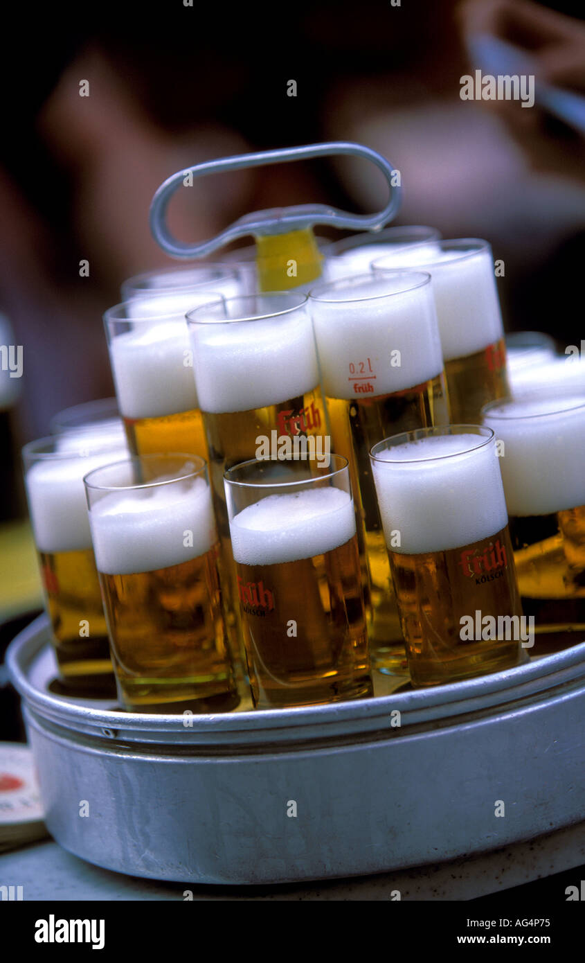 Germany North Rhine Westphalia Cologne Close up on the localy produced beer called Kolsch served in a traditional Stangen glasses outside the Fruh am Dom Beer Hall in the Altstadt Old Town Stock Photo