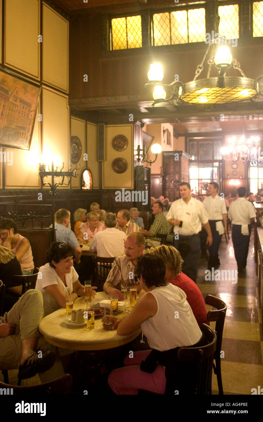 Germany North Rhine Westphalia Cologne People sitting inside the Fruh am Dom Beer Hall in the Altstadt Old Town Stock Photo