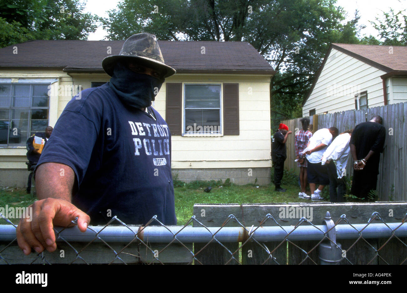 Detroit Narcotics team line up their prisoners after a raid of a known crack house Stock Photo