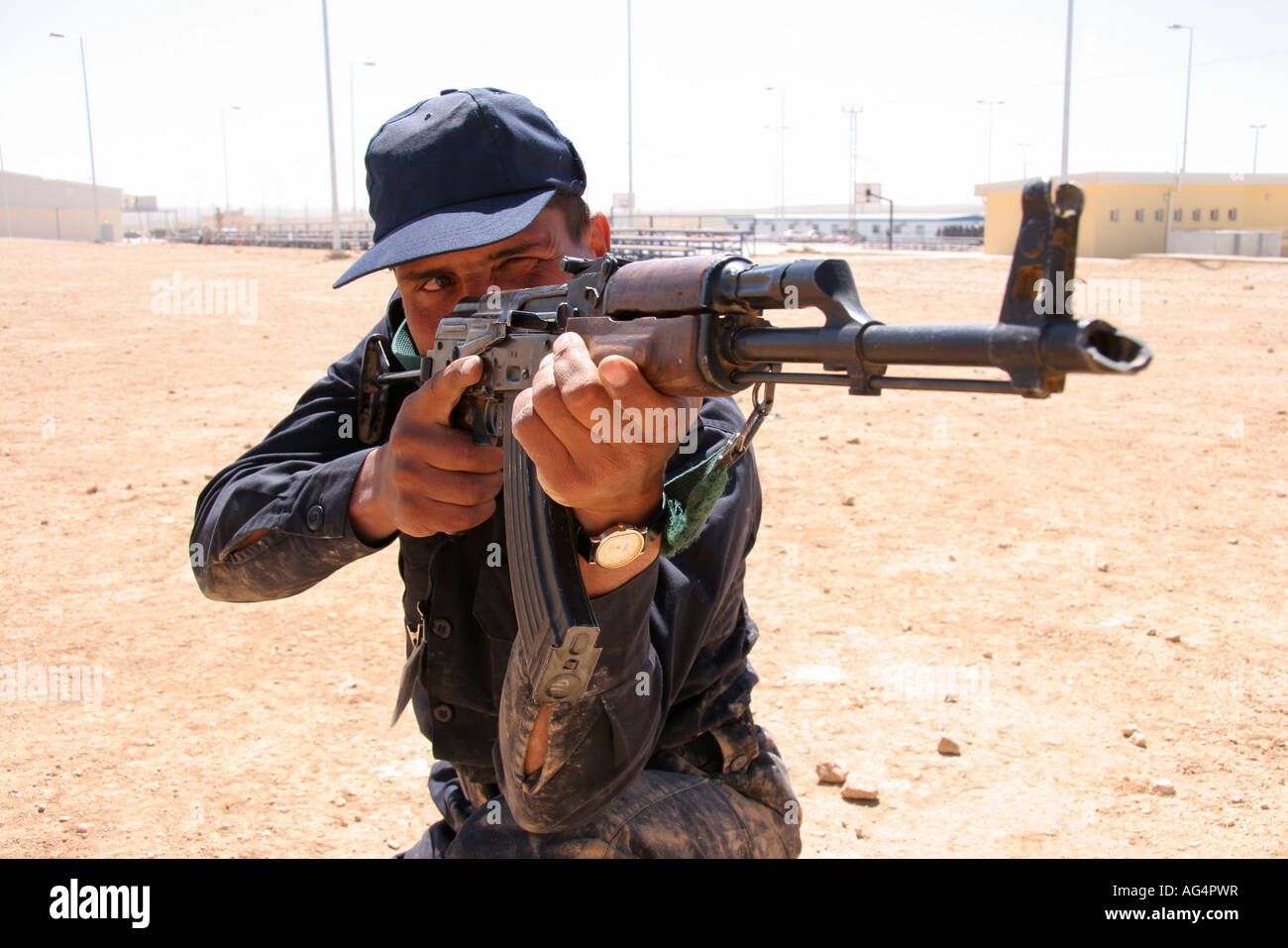 Iraqi police officer with AK47 Stock Photo