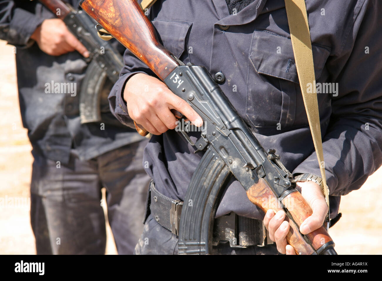 Iraqi police recruits holding AK47 s Stock Photo