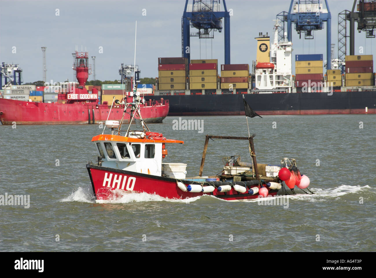 Small fishing vessel coming in to Harwich Port with Felixstowe