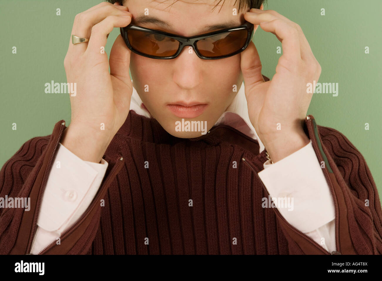 Man adjusting his sunglasses Stock Photo Alamy