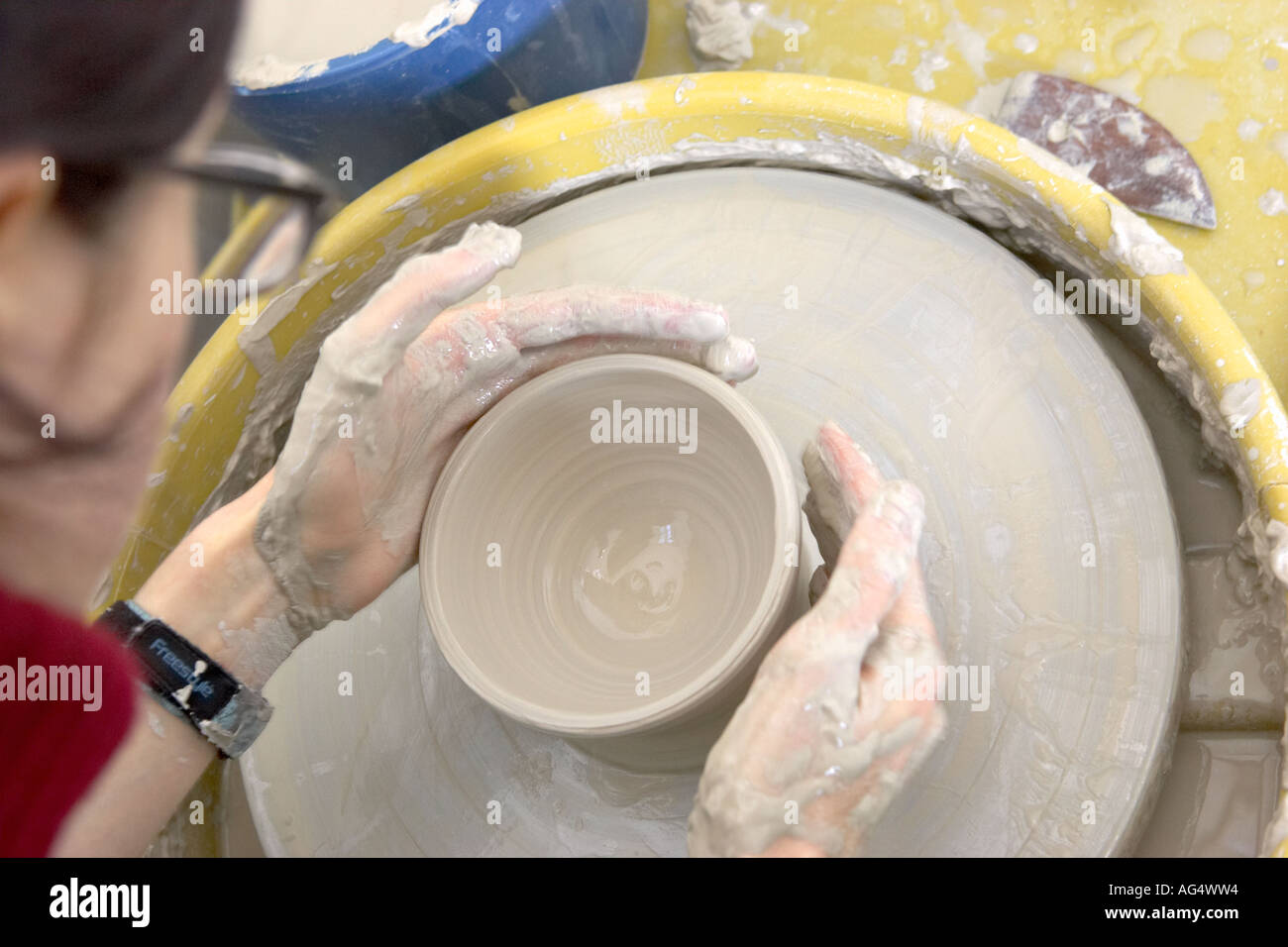 Female potter ceramicist working on wheel art arts and crafts hand made
