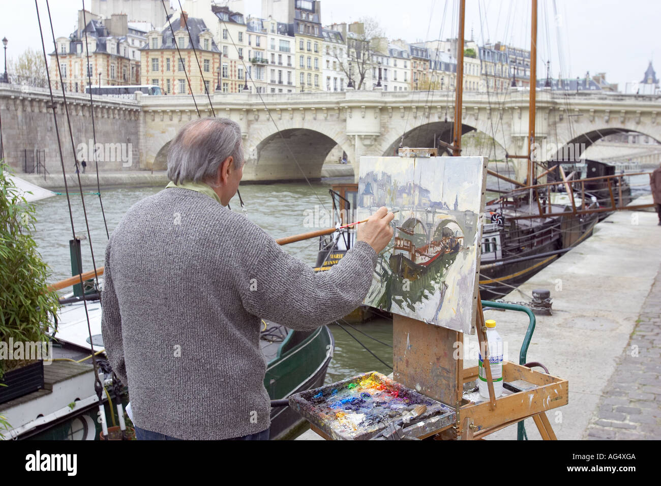 Man painting the Pont Neuf bridge Along the Seine River in Paris France  Europe France Paris world regions countries Paint painti Stock Photo - Alamy