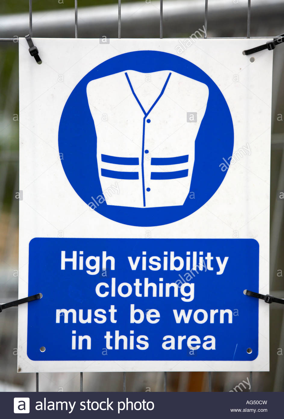 High visibility clothing must be worn in this area signpost Stock Photo ...