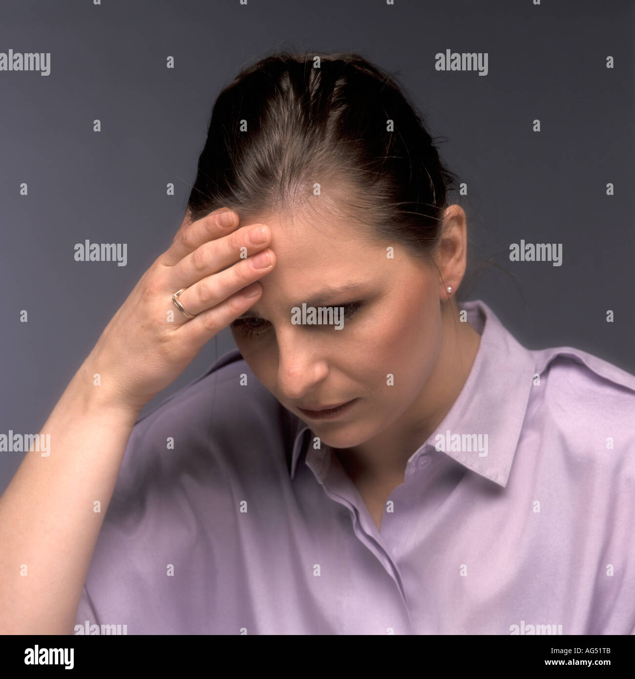 Woman with headache Stock Photo