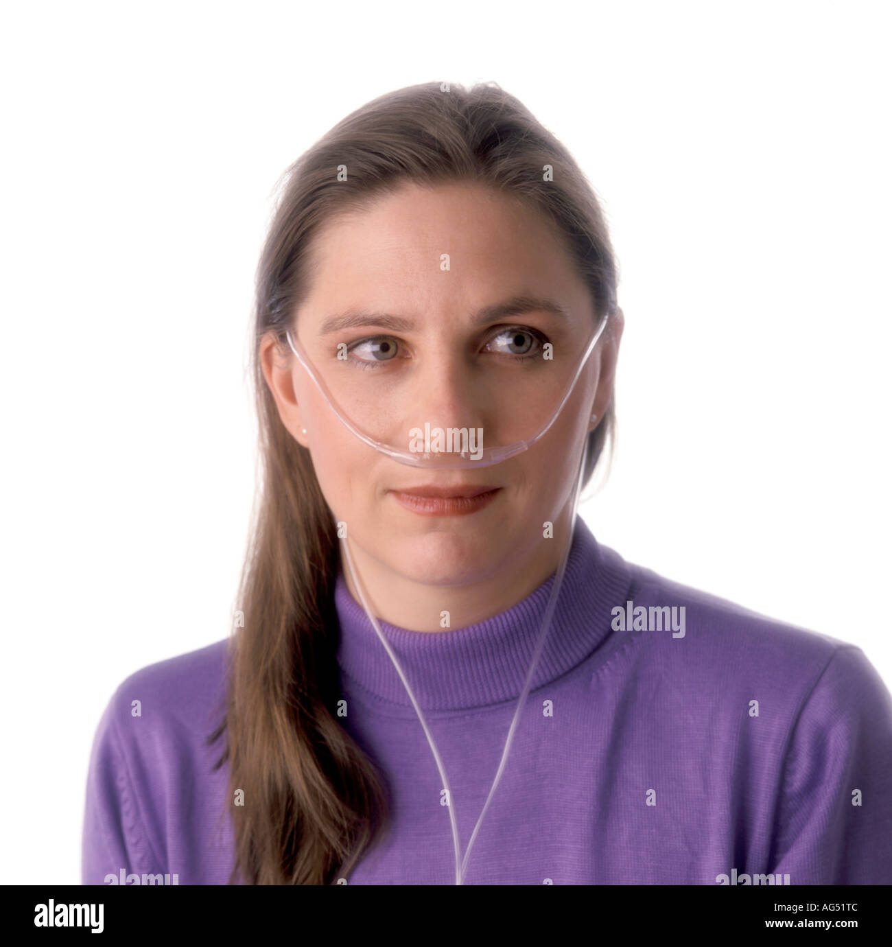 Woman wearing oxygen nasal cannula in her nose Stock Photo - Alamy