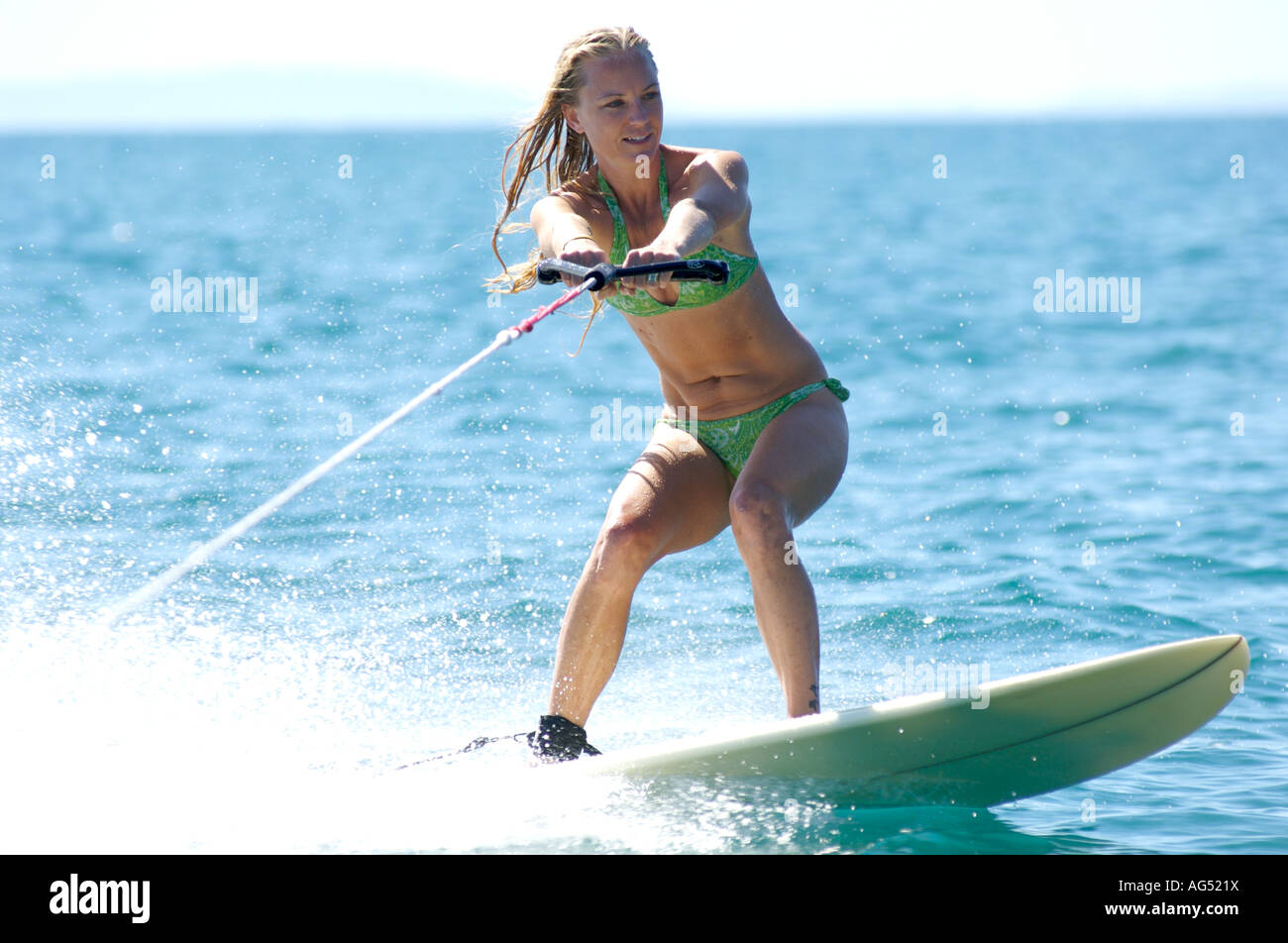 Blonde woman tow surfing Stock Photo