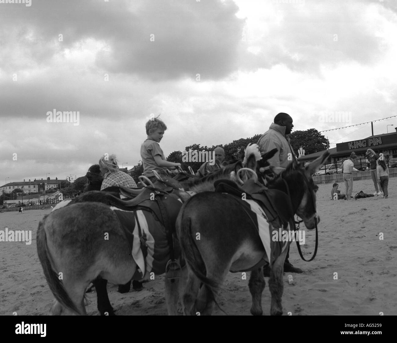 Donkey rides on a British Beach Stock Photo - Alamy