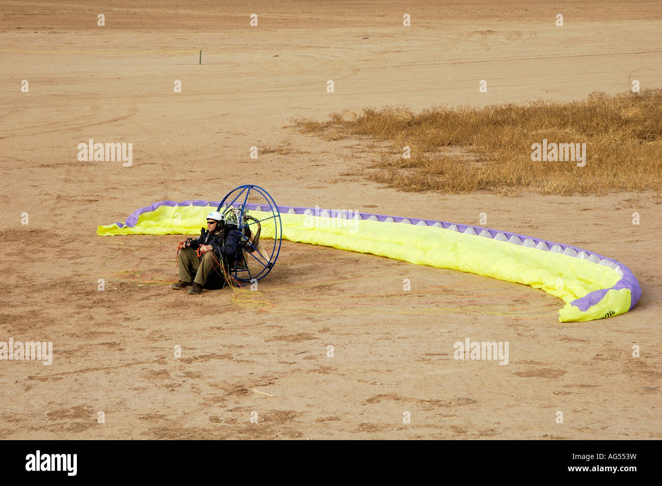 a powered paraglider pilot waiting for his turn to take off Stock Photo