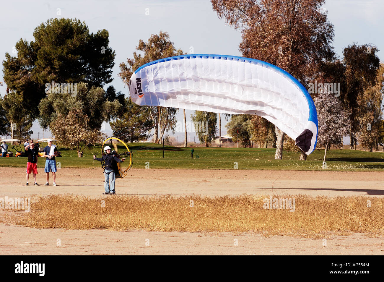 a powered paraglider pilot preparing to take off Stock Photo Alamy