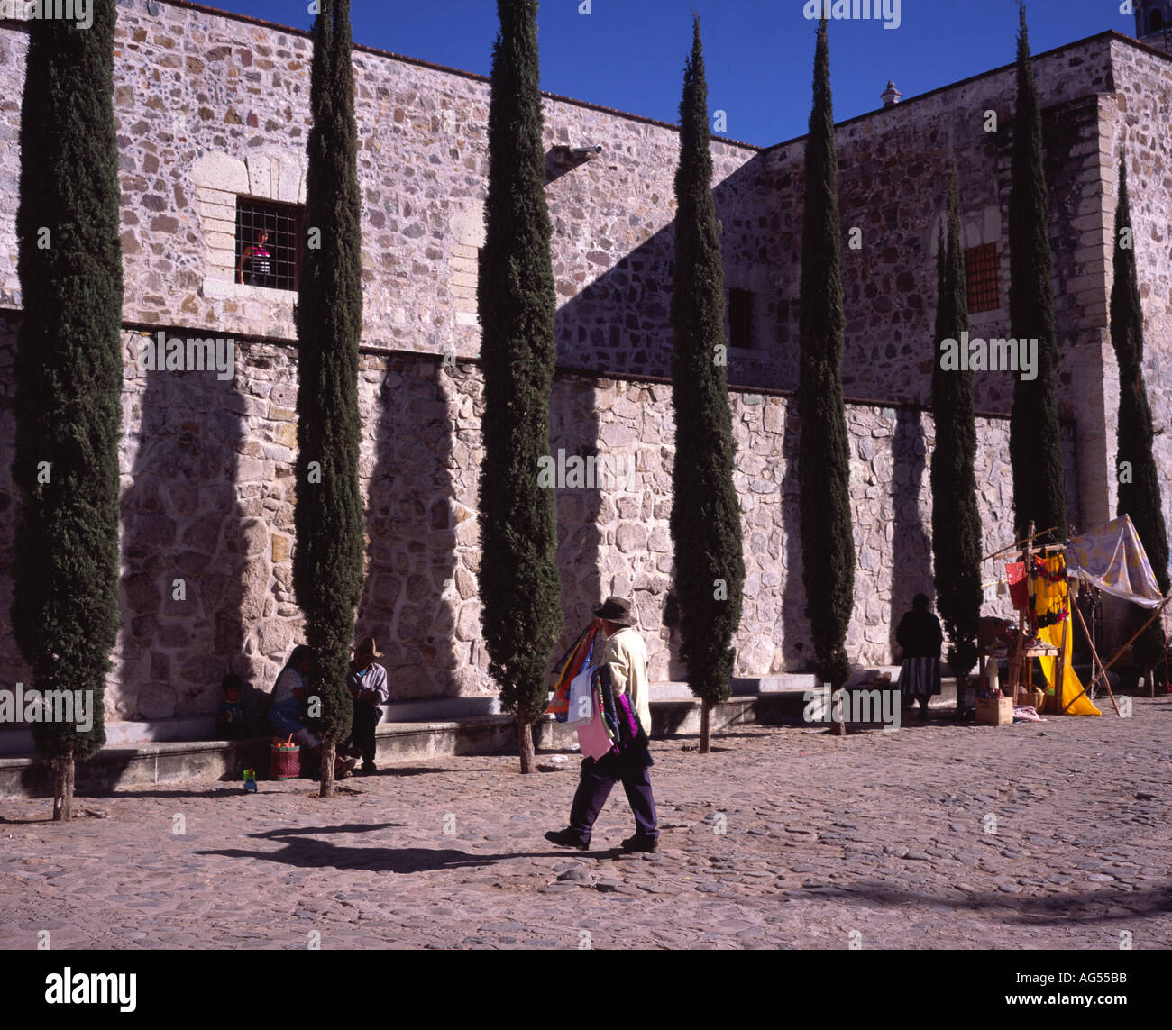 Man walking past the old convent at Ocotlán de Morelos, Oaxaca Mexico Stock Photo