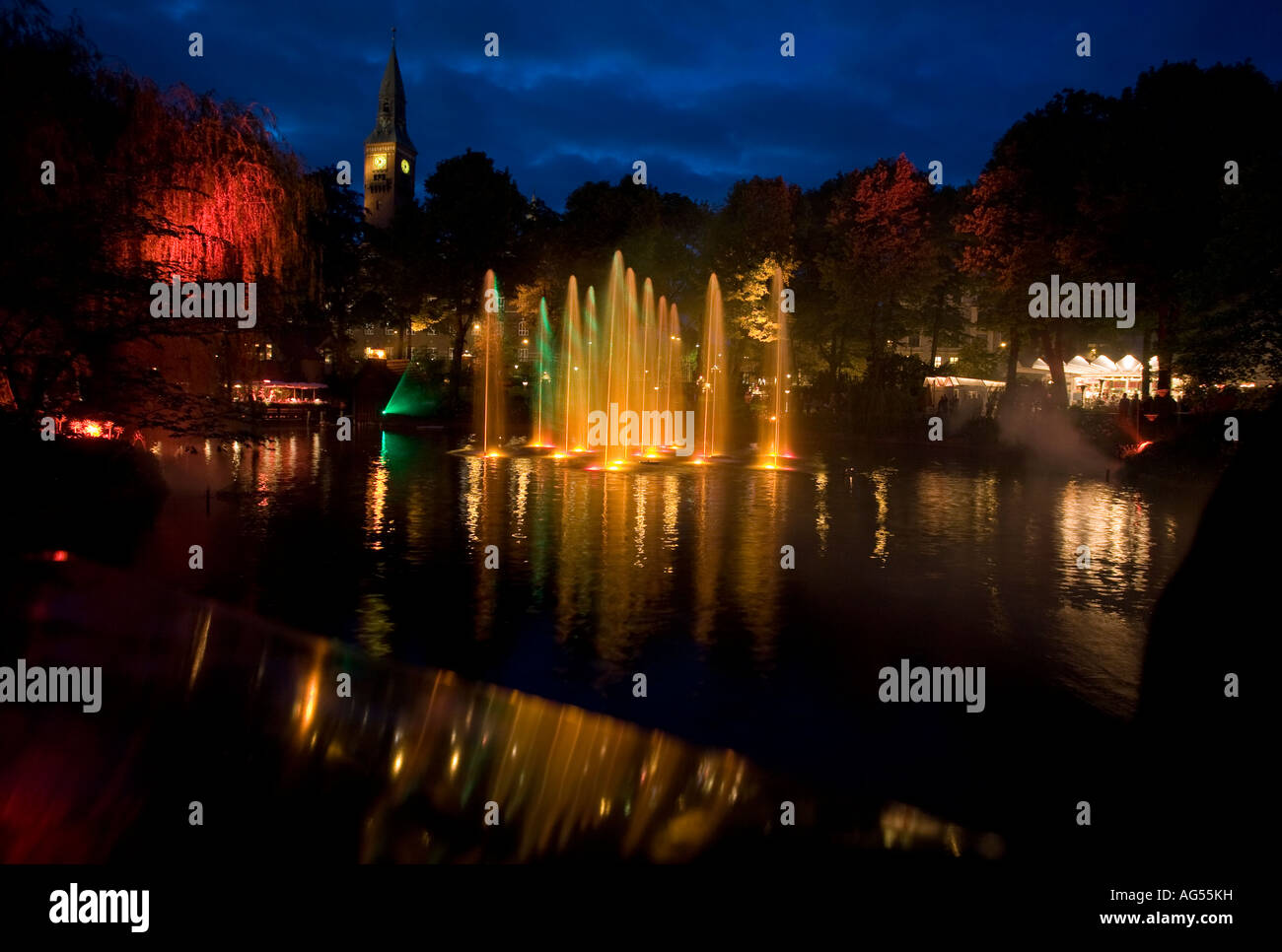 Laser and Fountain Show Yellow Fountains of water glow with the light