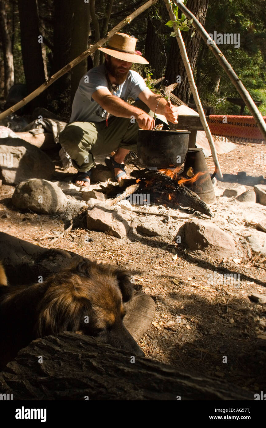South America Central Chile near Los Quenas rio Teno Chilean Adventures Base camp preparing rabbit stew over an open fire Stock Photo