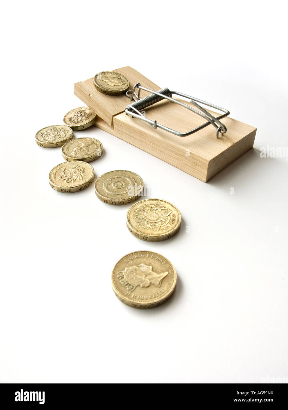 Mousetrap baited with money Stock Photo