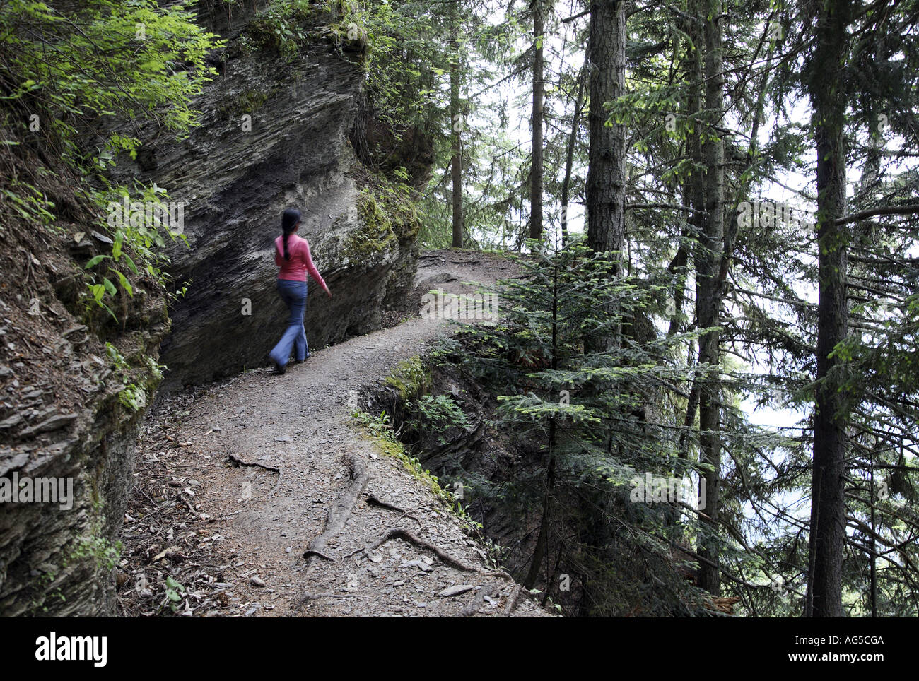 Girl walking alone in forest hi-res stock photography and images - Alamy