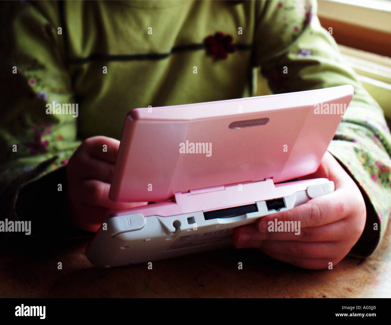 Playing Nintendo DS Stock Photo