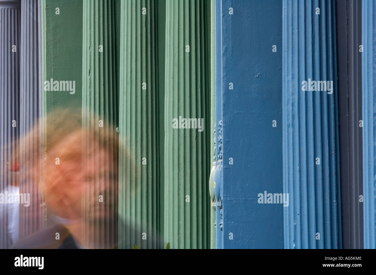 Blurred Male Pedestrian Walking Past Muli Colored Columns Charleston South Carolina Stock Photo