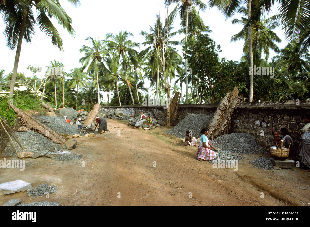 India Kerala Kovalam work women breaking rocks by the side of the road ...